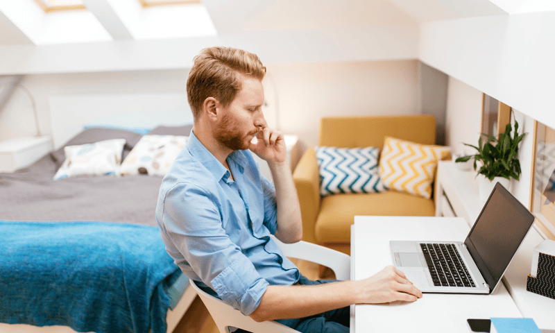 Man working from home from a vacation rental home